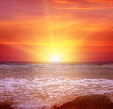 Photo of sunset on an ocean short to illustrate the warmth of God's love toward us.