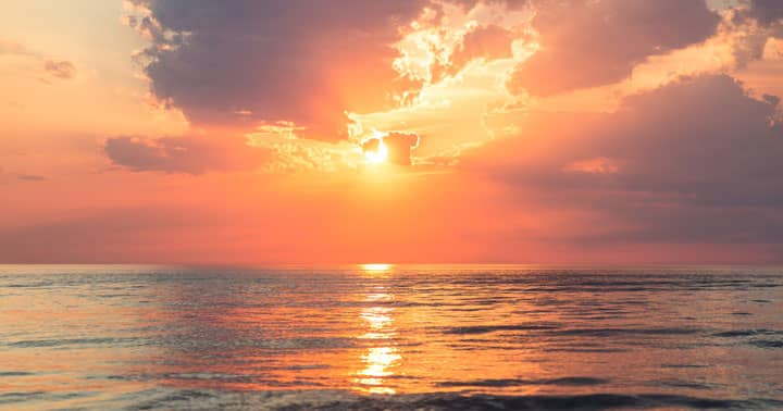 Who is God? Photo of an inviting beach, ocean waves, warm sun, to illustrate the inviting and approachable nature of God